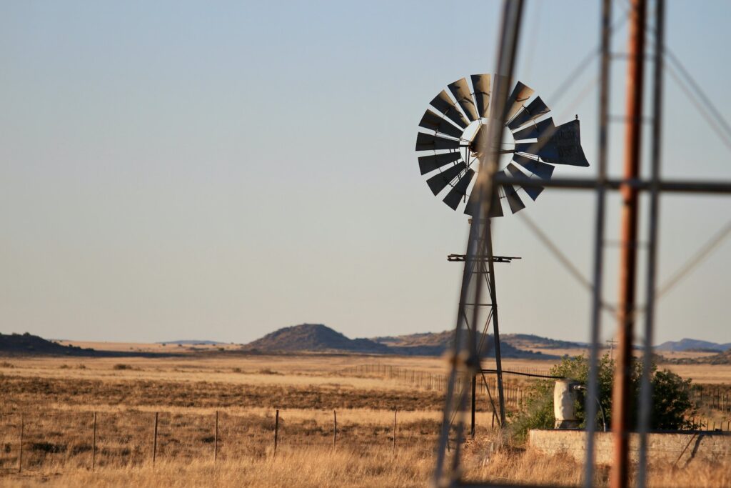 black windmill on brown field